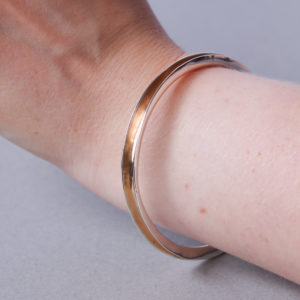 Wide silver forged bangle